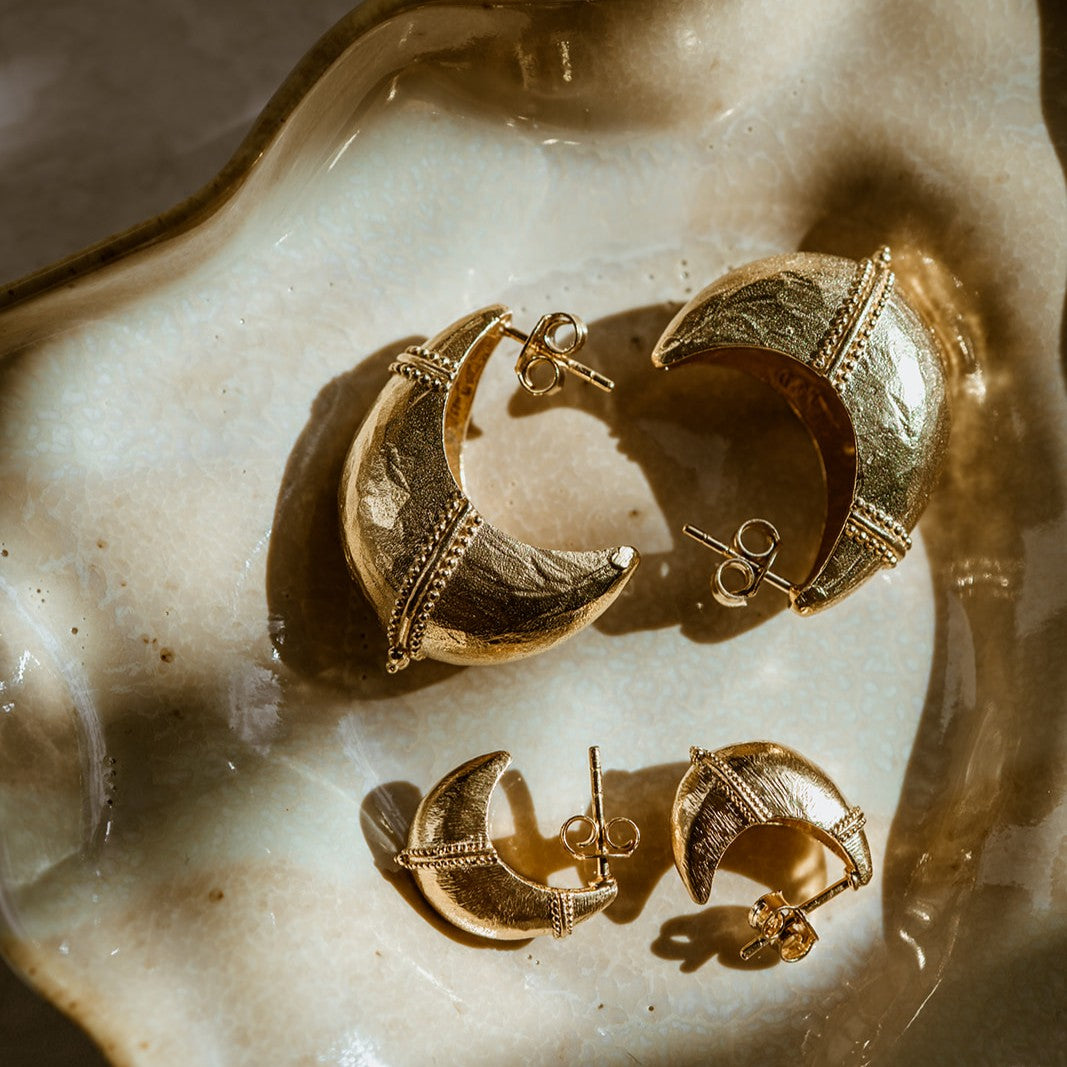 Antique inspired dome tribal earrings in natural light