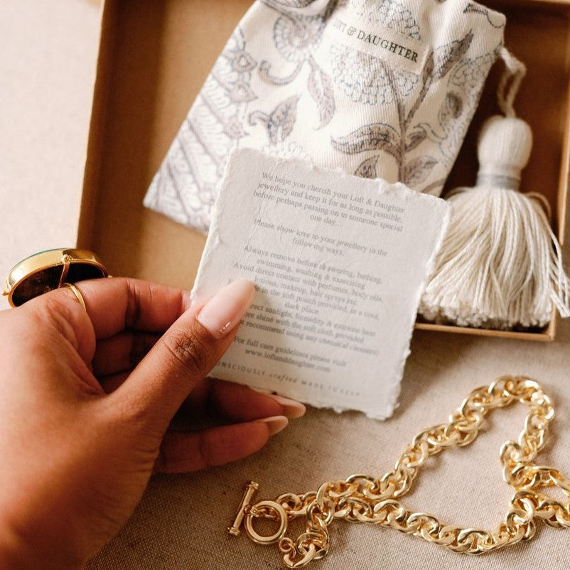 Loft & Daughter signature packaging featuring a rustic care card with soft organic block printed pouch