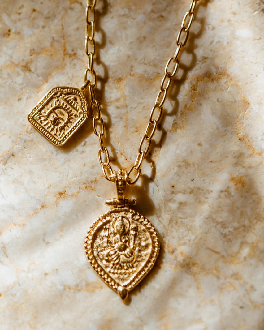 Double charm gold vermeil pendant featuring lord Ganesh and a lion amulet
