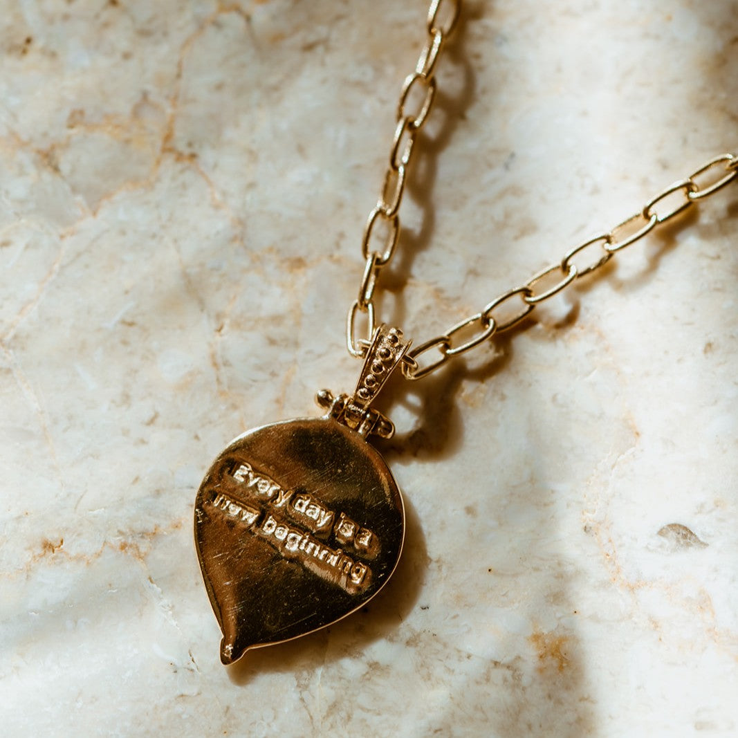 Teardrop shaped pendant with Everyday is a new beginning engraving