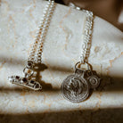 Protective Nivara Amulet Pendant with Athena You Got This coin pendant on marble background