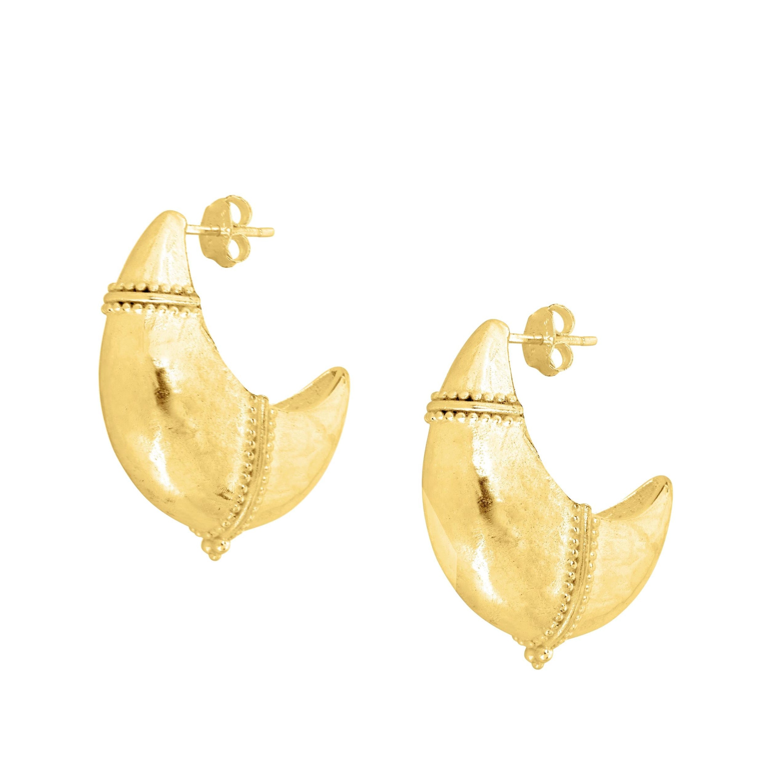 Chunky gold dome hoop earrings on white background