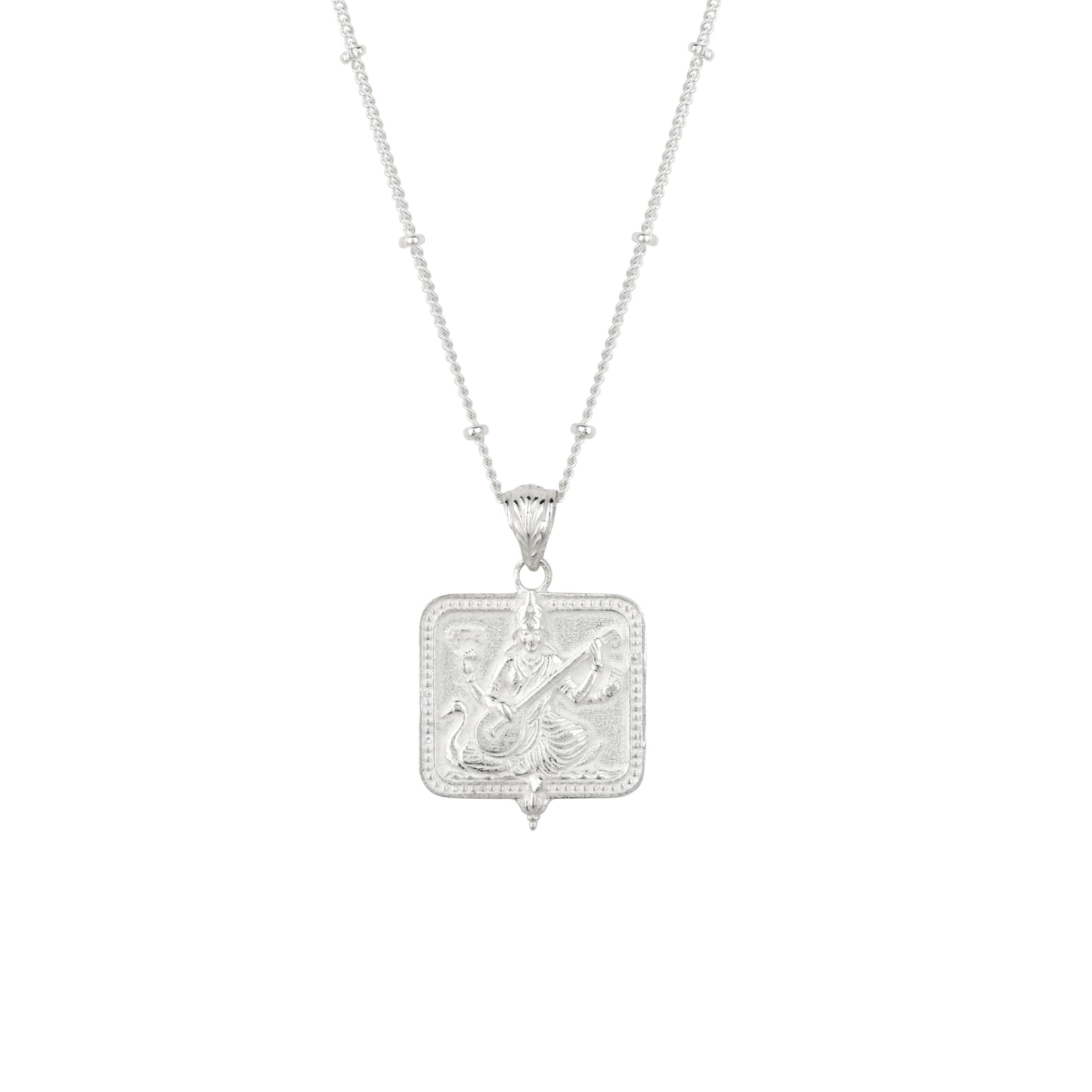 Silver Saraswati pendant necklace on a satellite chain
