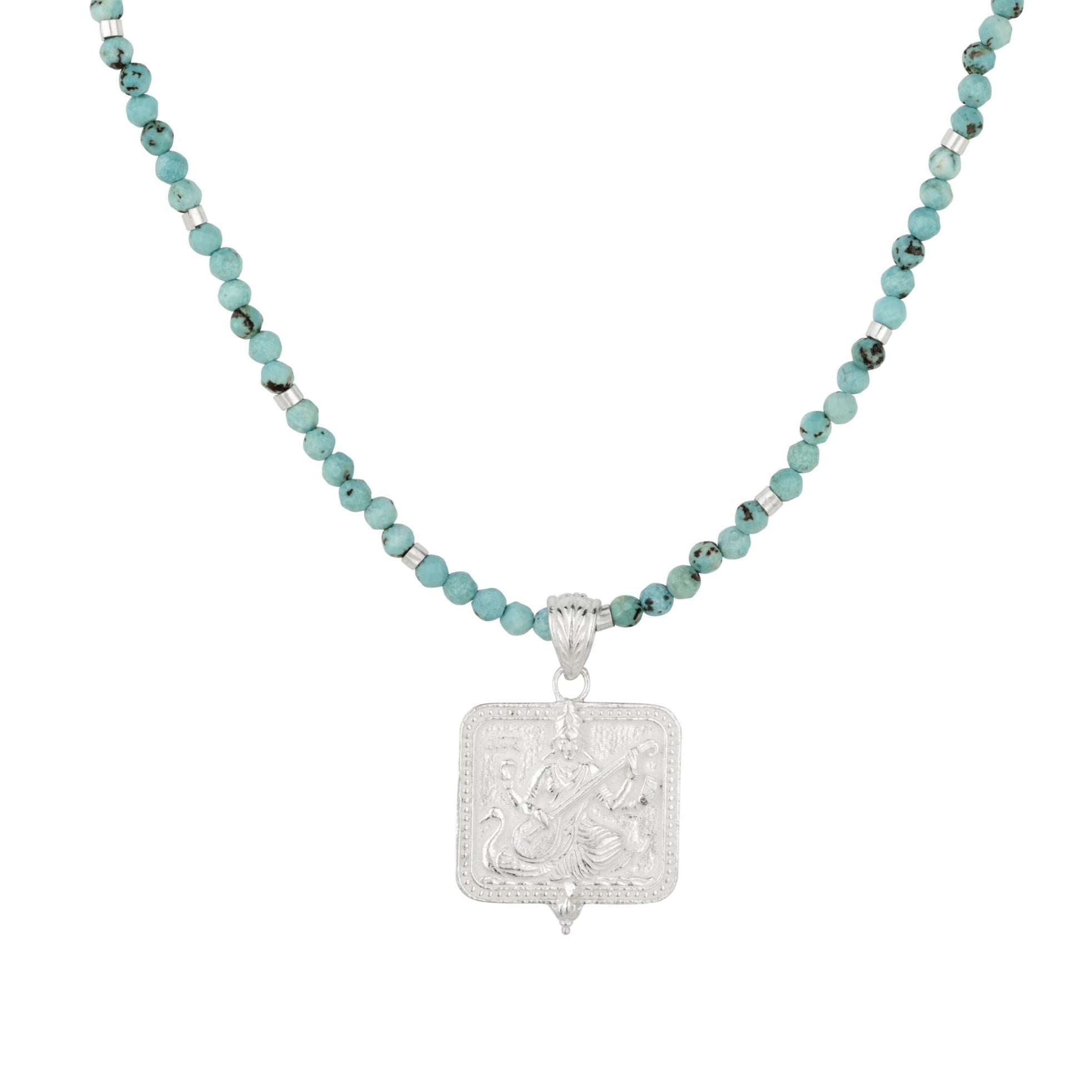 Silver Saraswati pendant on a turquoise beaded choker