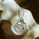 Detailed view of the Athena Shield Pendant in silver symbolising courage and inner strength