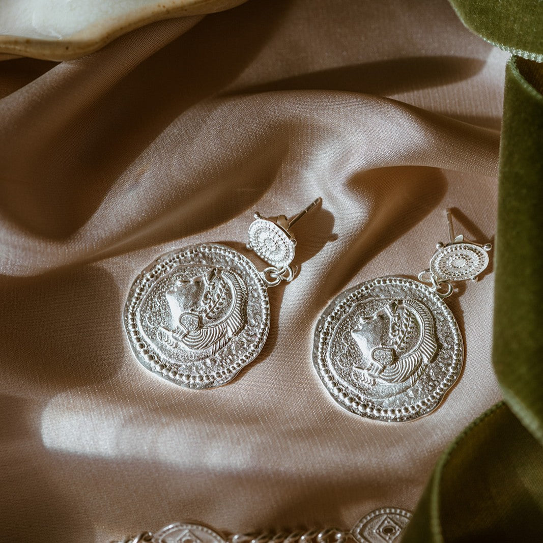 Close-up of You Got This Earrings featuring hand-crafted detailing and protective design