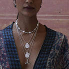 Woman wearing silver layered necklaces with a patterned kimono by Loft & Daughter
