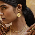 Model wearing You Got This Athena large coin earrings, inspired by the warrior goddess