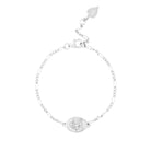 Silver bracelet with oval coin featuring Durga on a white background