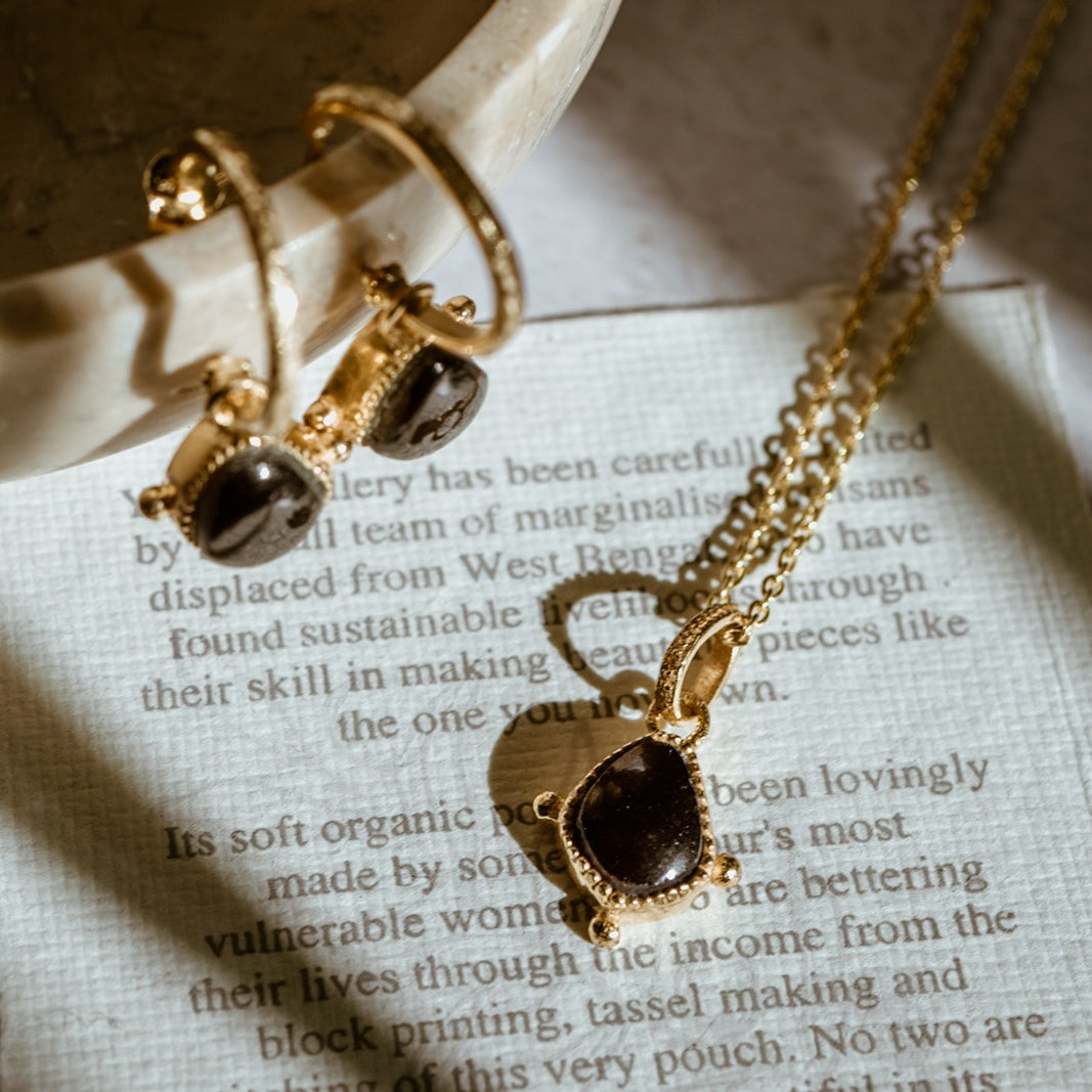 Gold vermeil red garnet charm pendant and matching earrings on care card