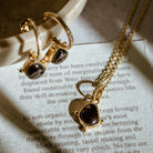 Gold vermeil red garnet charm pendant and matching earrings on care card