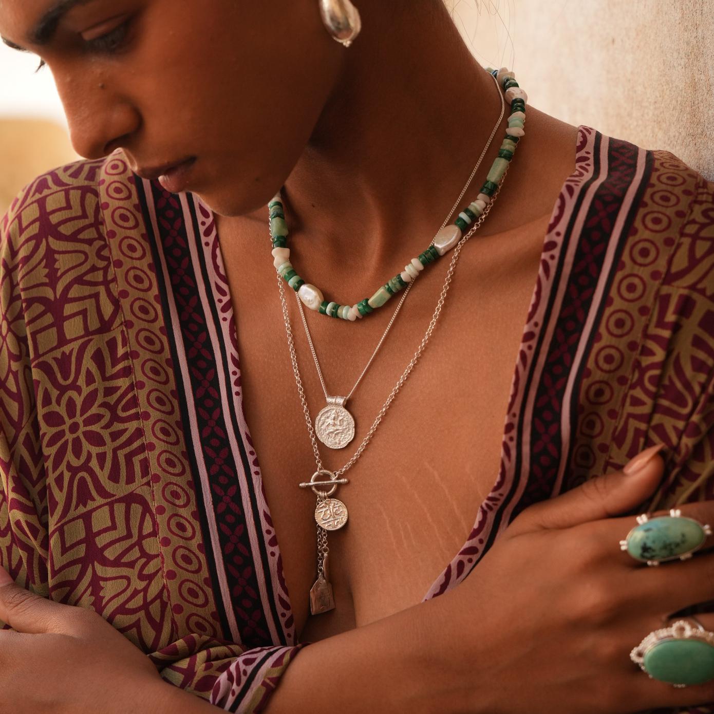 Model wearing bohemian silver necklace stack with gemstone choker
