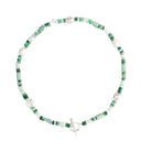 A beaded necklace featuring green and white beads with a silver toggle clasp, displayed on a clean white background.
