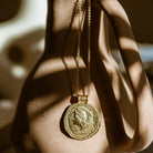 Gold You Got This Pendant by Loft & Daughter hung on a vase