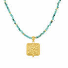Gold vermeil Saraswati charm on a turquoise beaded choker