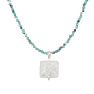 Silver Saraswati pendant on a turquoise beaded choker