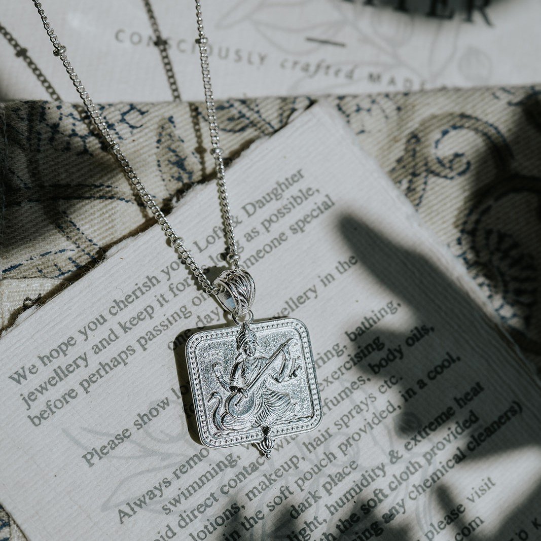 Silver Saraswati pendant necklace on a Loft & Daughter jewellery card