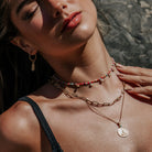 Model wearing boho summer necklace stack